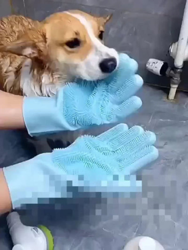 Aurel Shop pet grooming gloves being used to wash a wet corgi in a bathroom setting